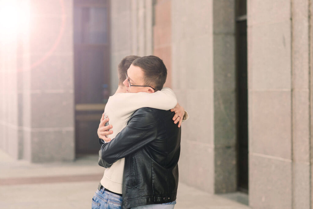 Gay Couple embracing outside representing the connection that can be formed with your partner with the help of Couples Counseling in San Antonio, TX.