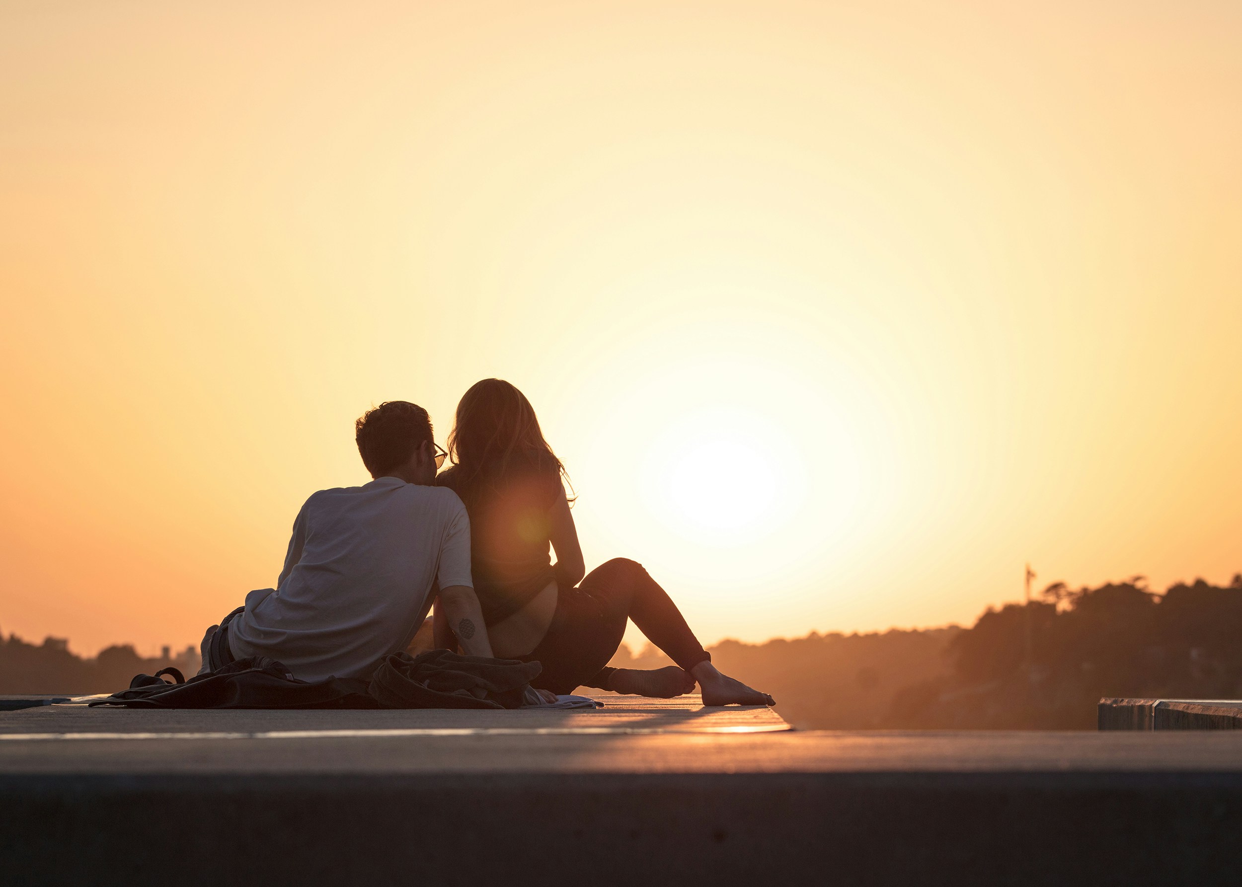 Couple sitting and staring out into the distance while having a deep conversation and bonding. Modern Wellness Counseling, San Antonio, Tx. 78230,78245,78249,78255,78258,78260.