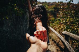 couple holding hands while they take a walk, spending time together and bonding, enjoying their day together. San Antonio, Tx, Modern Wellness Counseling. 78230,78245,78249,78250,78255,78258,78259